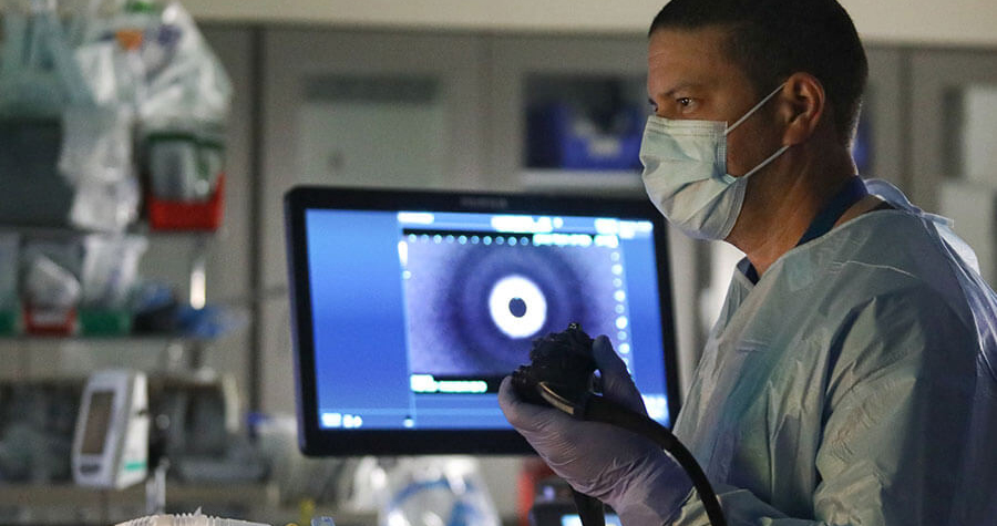 Physician looking at results on monitor