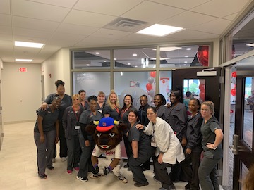 Buster Bison was on hand to help the staff celebrate the grand opening of General Physician, PC's new primary care center. 