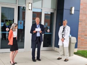 Outgoing-CEO-Nils-Gunnerson-addresses-the-crowd-alongside-Dr.-Virginia-Bond-and-Dr.-Edwin-Heidelberger-at-the-ribbon-cutting-ceremony-for-the-new-BCHC-on-Wednesday-Sept.-21-300x225.jpg